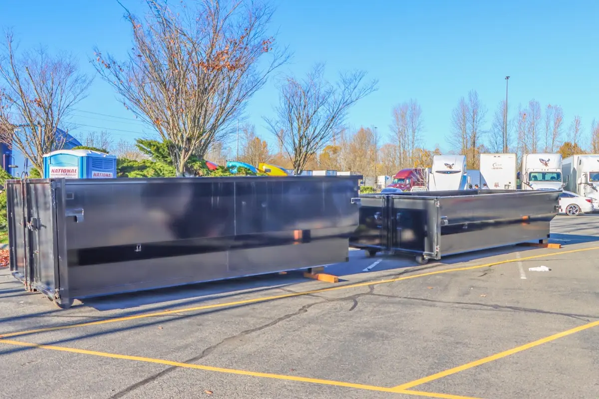 Professional dumpster rental service with roll-off container on residential driveway in Gardnerville